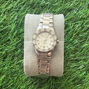 Bulova ladies’ stainless steel watch with white dial and diamond‑accent markers